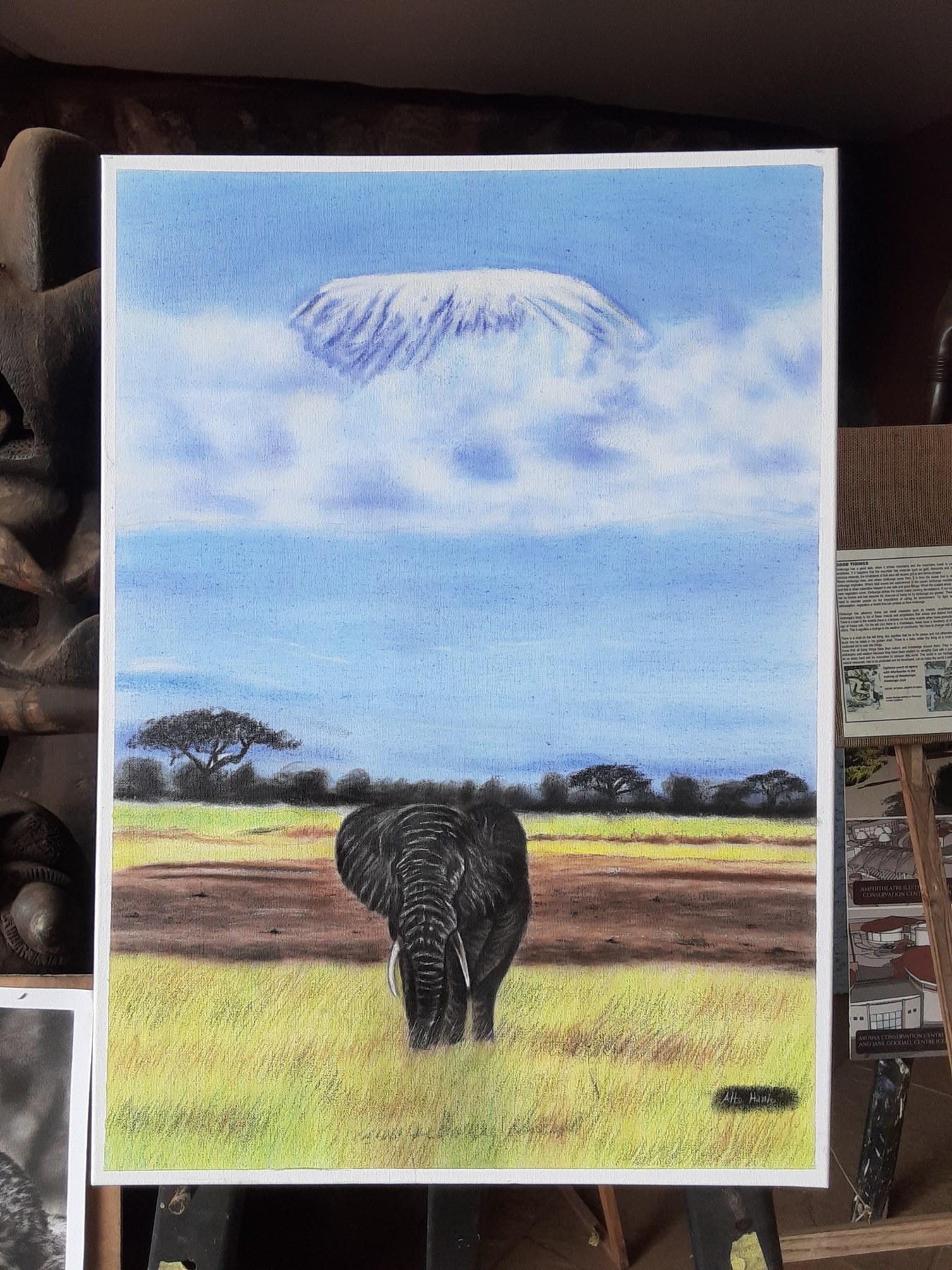 Color landscape artwork of an elephant below Mount Kilimanjaro